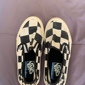 Black and white checkered vans.